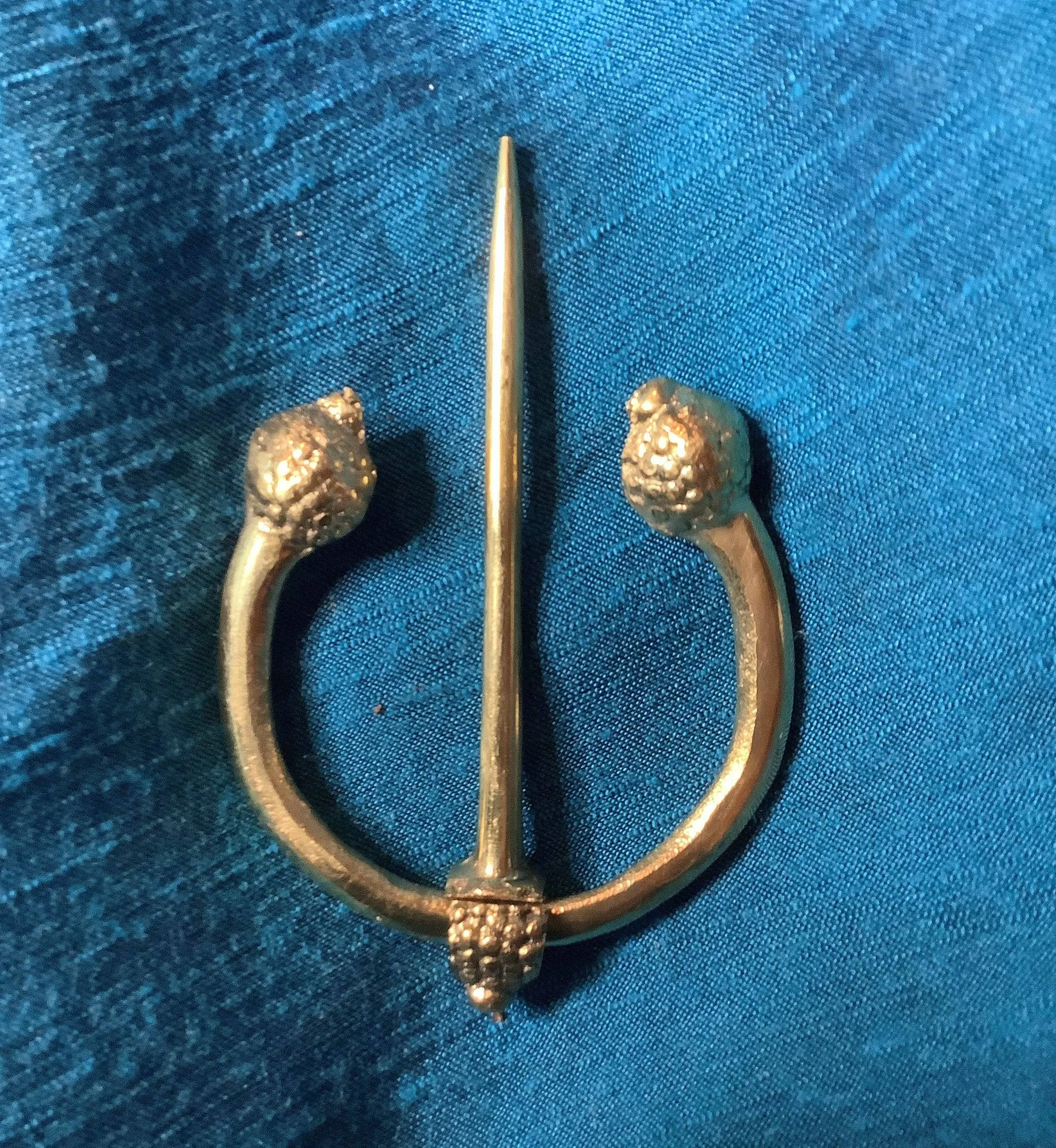 Penannular Brooch with Thistle Terminals