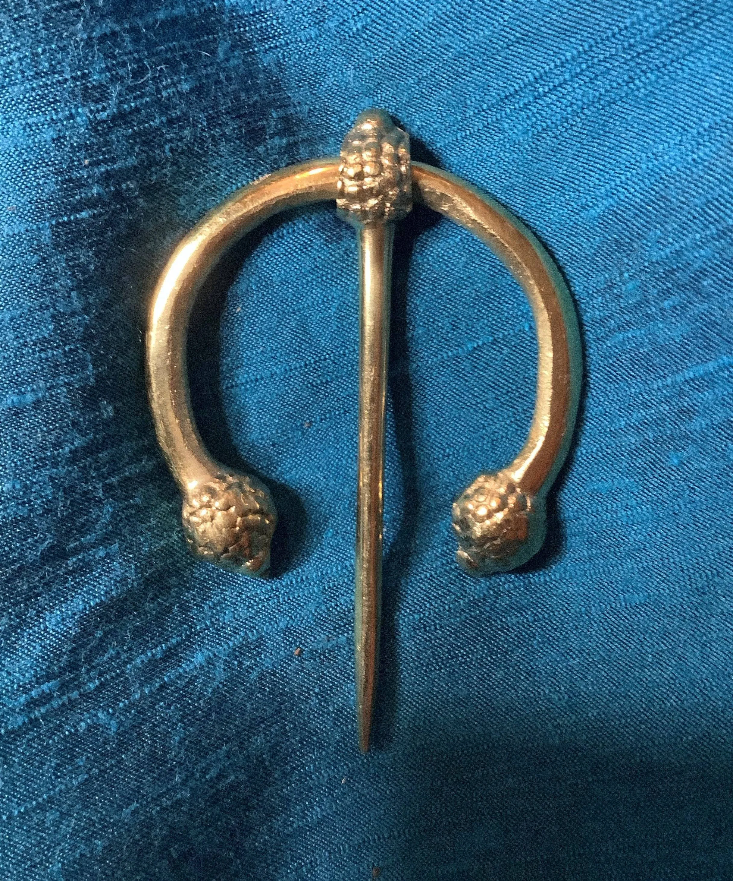 Penannular Brooch with Thistle Terminals