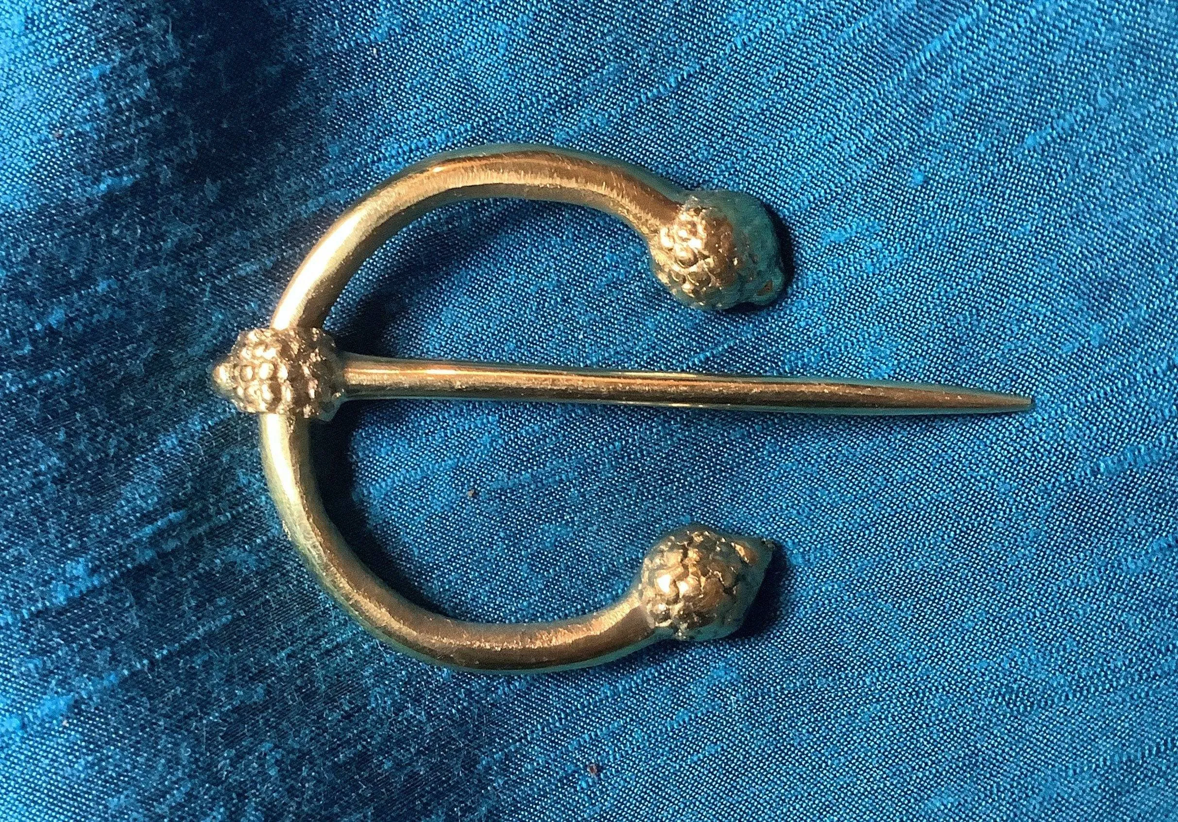 Penannular Brooch with Thistle Terminals