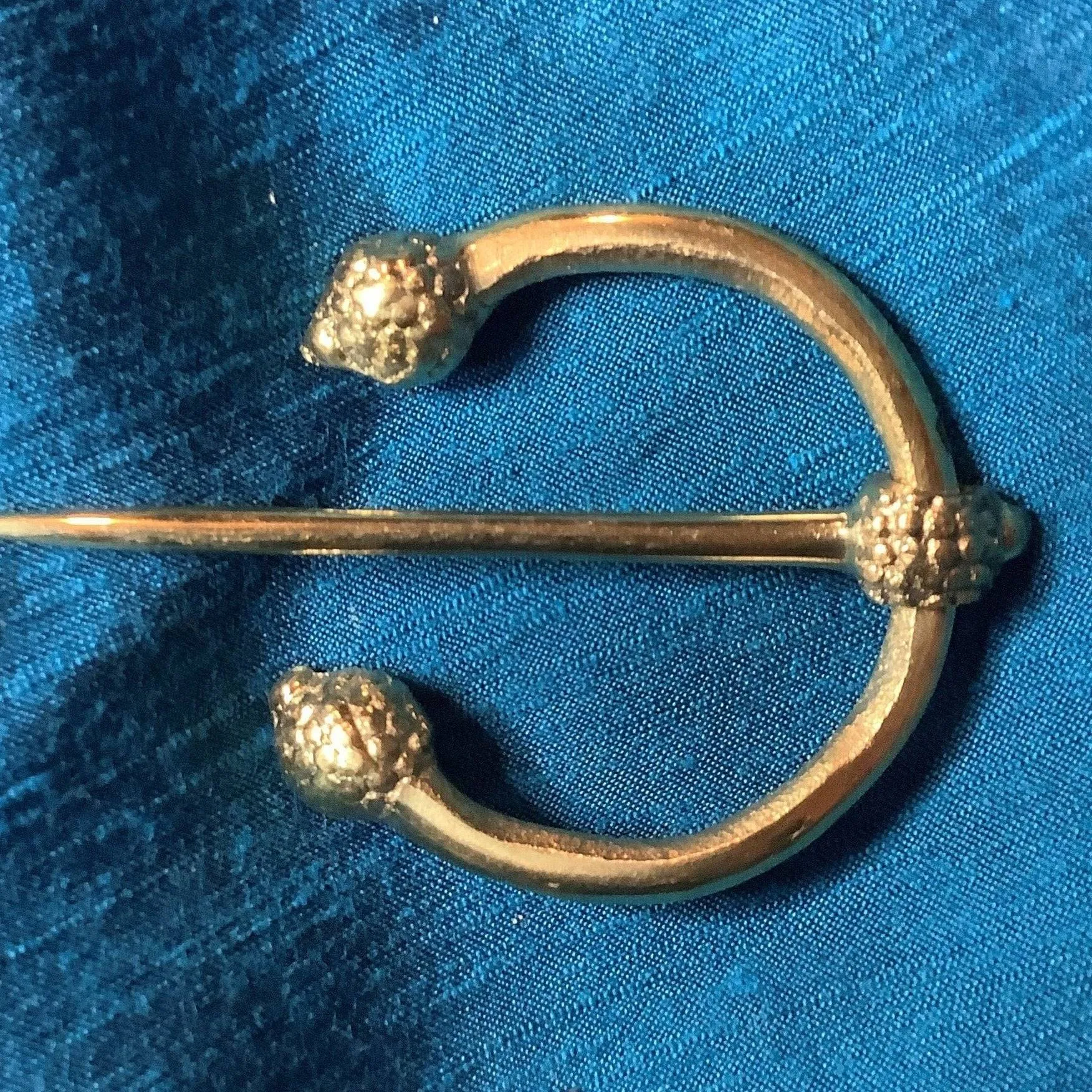 Penannular Brooch with Thistle Terminals
